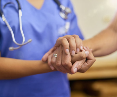 Nurse, holding hands and elderly support in house, patient and trust or hope and compassion with medical employee. Caregiver, nursing home and volunteer or consultation, gratitude and people togetherの写真素材
