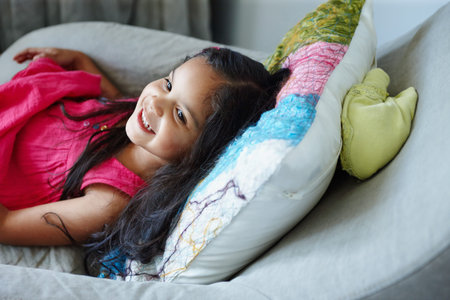 Thinking, relax and child in home with smile for rest, development and inspiration with creative...