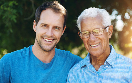 Happy man and senior father in portrait together outdoor for love embrace on holiday or retirement....