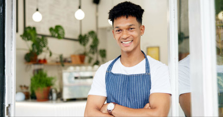 Man, face and coffee shop barista with smile or customer service or waiter at bakery, welcome or...
