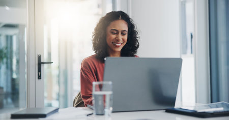 Businesswoman, reading and happy with laptop in office for project management feedback and positive...
