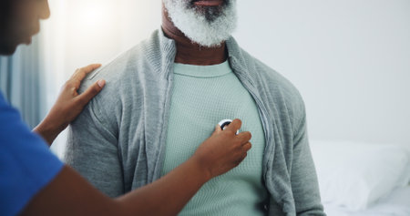 Senior, man and nurse with stethoscope on heart for heartbeat assessment, cardiovascular health or asthma. Elderly patient, doctor and cardiology in hospital for lung disease, chest infection or helpの写真素材