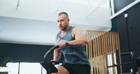 Fitness, gym and man on stepping machine for health, muscle and body workout or training. Sports,...