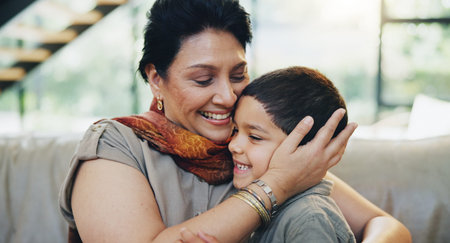Smile, child and hug grandmother on sofa at house for bonding, love and relax with care on weekend...
