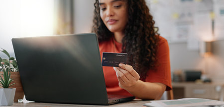 Woman, laptop and credit card for creative business, fintech and online transaction with entrepreneur for internet investment. Banking, payment and purchase for agency inventory, shopping and officeの写真素材