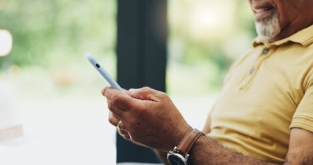 Hands, phone and mature person on internet for reading news, email or crossword puzzle in home....
