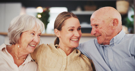 Senior parents, daughter and happy home in couch for love, support and care with trust. Parent, living room and smile in couch for bonding, love and comfort as family with retirement or pensionの写真素材