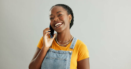 Woman, phone call and talking in studio with smartphone, online communication and conversation on...