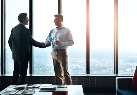 Men, handshake and window in office for partnership, greeting and onboarding in modern workplace....