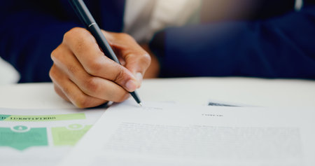 Businessman, hand and signature for document in office with application and legal contract for compliance. Male attorney, fingers and writing on paperwork for policy agreement and partnership dealの写真素材