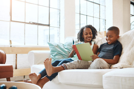 Reading, children and book on sofa house for knowledge, bonding or learning literature, fantasy and...