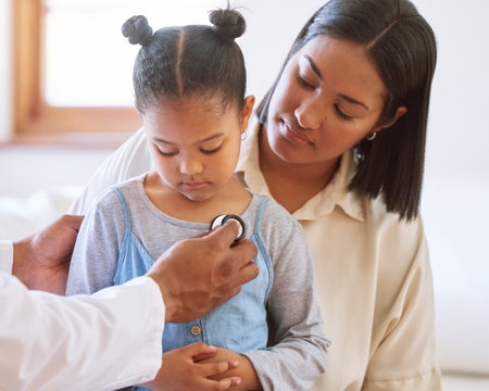 Girl, mother and doctor with stethoscope in healthcare for listening to heartbeat, lung assessment or chest checkup. Cardiology, pediatrician and medical tool for examination, evaluation or diagnosisの写真素材