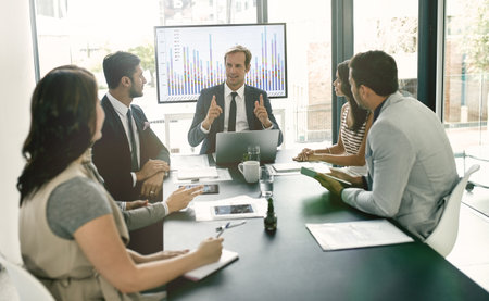 Business people, team and discussion with data on screen for sale metrics review, insights and planning. Meeting, speaking and finance or trading analytics for asset performance and profit managementの写真素材