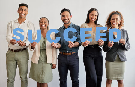 Happy, portrait and business people with letters for success, goals or mission in career or job...
