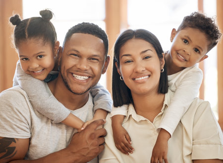 Family, hug and portrait in lounge for care, smile and connection or security in home for bonding. Parents, children and relax on couch for happiness, embrace and together for support or bondingの写真素材