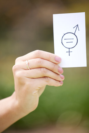 Icon, hand and person with card for gender equality, inclusion and support for income opportunity in protest. Justice, balance and activist with sign for salary equity, human rights and equal payの写真素材
