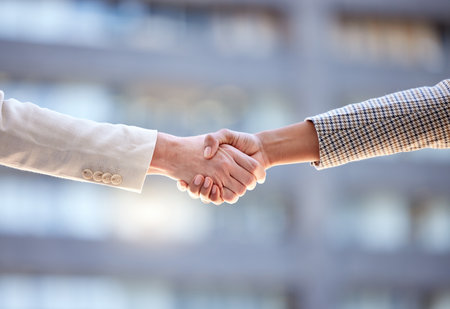 Business people, closeup and handshake for agreement, b2b deal and cooperation for project. Shaking hands, contract and employees with teamwork, greeting and thank you for promotion and negotiationの写真素材