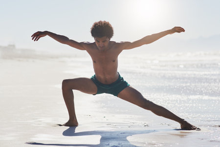 Dance, performing and man at beach with contemporary for choreography, balance or competition training. Body, sunshine and male person on shore for workout, freestyle movement and routine in Jamaicaの写真素材