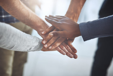 People, hands and huddle together for teamwork, problem solving and collaboration on company...