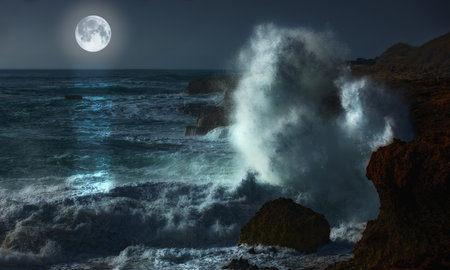 Night, moon and waves in ocean for landscape, natural beauty or peace with environment. Dark, sea and rocky coastline with planet glow or energy in summer, water storm on vacation in Mauritiusの写真素材