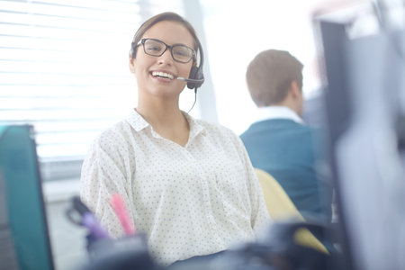 Woman, happy and portrait of consultant in call center for online assistance, advice and customer support for inbound sales. Girl, virtual assistant and agent for crm, contact us and telemarketing.の写真素材