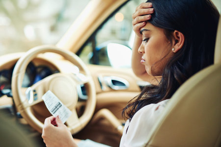 Woman, stress and traffic fine in car for speed, safety and road rules or policy with risk of danger...