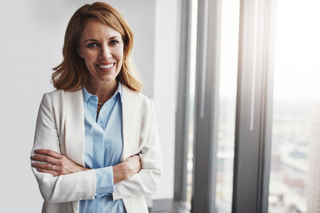 Business, happy woman and portrait with pride in office, confidence or arms crossed for corporate company. Professional, career or female employee as hr manager for admin, job or management by windowの写真素材