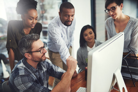 Group, people and leadership in office with computer, diversity in startup with training for website design. Team, manager or coaching for global employees with desktop, development with mentorの写真素材