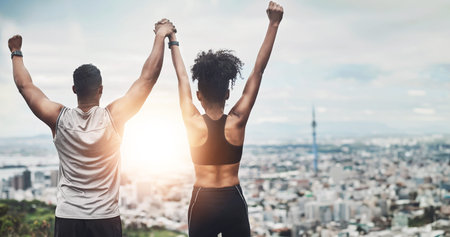 People, runner and victory or back with city, celebration and arm for achievement or fitness goals...