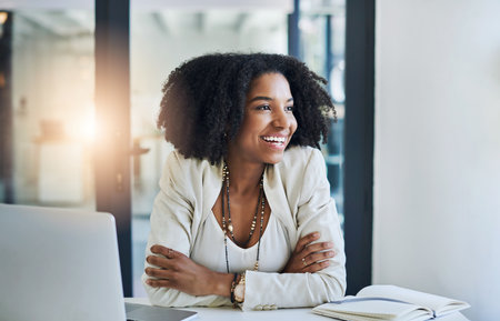 Business, thinking and black woman with laptop, inspiration and online reading for choice, decision and lens flare. African person, startup and copywriting consultant with pc or problem solvingの写真素材