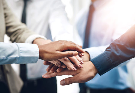 Business people, stack or hands together for collaboration, support or meeting for corporate goals. Mission, group and partnership with closeup for teamwork, target and staff synergy for motivationの写真素材