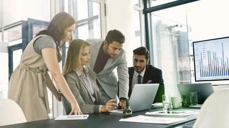 Group, business meeting and laptop for statistics in corporate as consultant in accounting firm or bank in workshop or office. Screen, people and tech in collaboration for growth or career in financeの写真素材