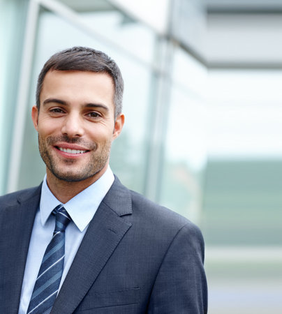 Businessman, happy and portrait in office with smile for career, work and company or corporate job. Lawyer, face and professional in law firm for contract, clients and schedule or project with prideの写真素材