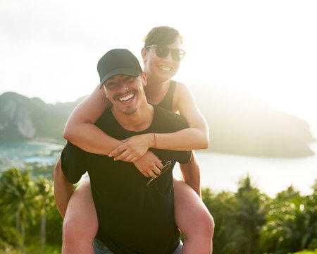 Love, nature and couple piggyback on Thailand adventure for holiday, vacation and hiking on date....