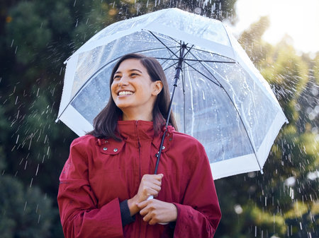 Umbrella, rain and woman with smile, walking and carefree in weather of Seattle, travel and explore...
