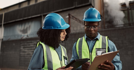 Construction site, clipboard and people on tablet for planning, building inspection and maintenance....