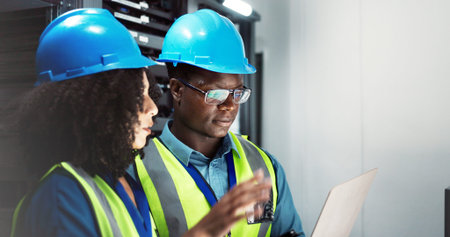 People, maintenance and laptop in server room working, technician and firmware installation or...
