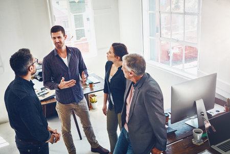 Mentor, businessman and people in meeting for discussion by networking, planning and training with...