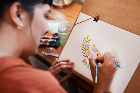 Woman, house and artist painting with color for design with closeup, passion and paintbrush. Painter, drawing and flowers for creativity in home studio with talent, hobby and inspiration with skill.の写真素材