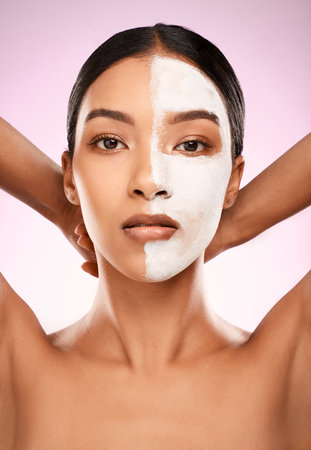 Woman, facial mask and portrait in studio for treatment, detox and skincare on pink background. Female person, beauty and half for comparison results, acne cosmetics and exfoliate with dermatologyの写真素材