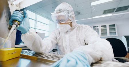 Innovation, research and science with person in laboratory for biology, breakthrough or pharmaceutical discovery. Vaccine, experiment or sample and scientist with pipette at work for developmentの写真素材