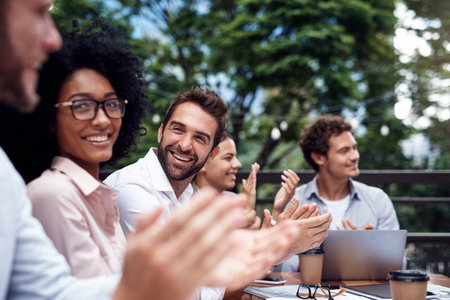 Meeting, business people and applause in cafe for success, achievement and good news. Celebration, finance men and women in accounting firm for project report, well done or clapping hands for victoryの写真素材