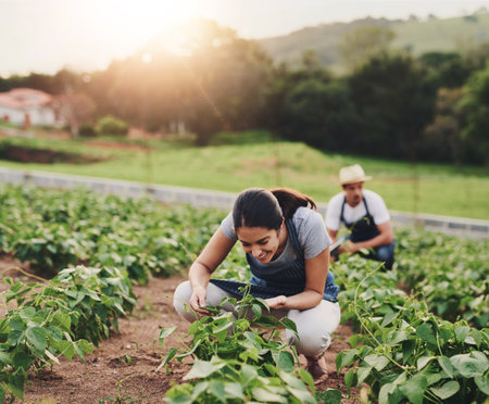 Outdoor, farming and woman with smile for crops, organic and growth of vegetable, field and eco friendly. Harvest, farmer and happiness for produce, sustainable and agriculture in environmentの写真素材