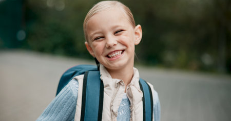 Child, portrait or happy girl ready for education development, opportunity or studying with smile. Funny face, learning and proud female student excited by back to school, knowledge and scholarshipの写真素材