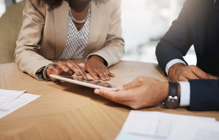 Meeting, contract and hands of business people with tablet in office for b2b deal, planning or documents. Paperwork, online agreement and partnership with financial advisor, client and digital appの写真素材
