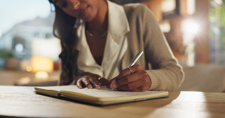 Hands, business and woman with notebook, writing and planning for project, schedule and deadline....