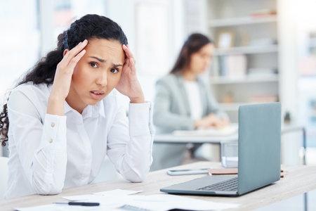 Woman, portrait and headache with fatigue, burnout and mental health for deadline or work. Stress,...