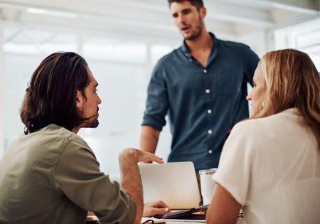 Business people, meeting and teamwork to startup tech company with ideas, problem solving or manager feedback. Group, programmer or web developer talk of software, information or product developmentの写真素材