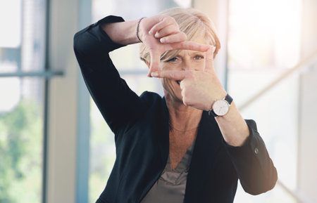 Mature, business and woman with finger frame for portrait in office, leader and ambition of...
