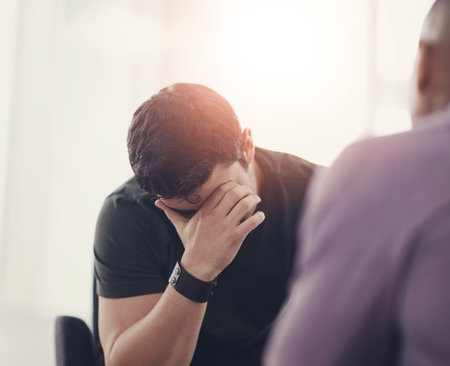 Bankruptcy, financial crisis or unemployment and business man in office with human resources for job loss. Anxiety, fired and stress with employee in workplace for economic recession or failureの写真素材